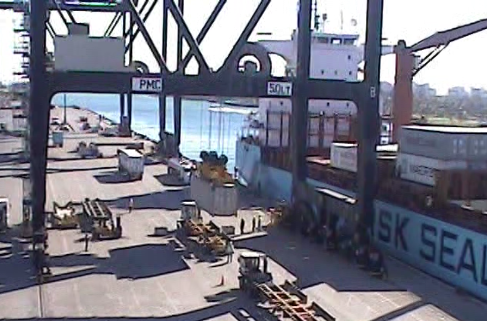 Mule Vehicle being Loaded with Container from Port Crane