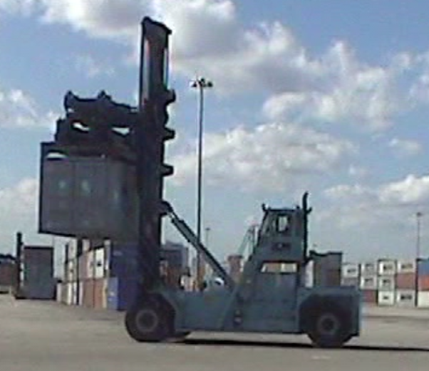 Top Loader Carrying a Container