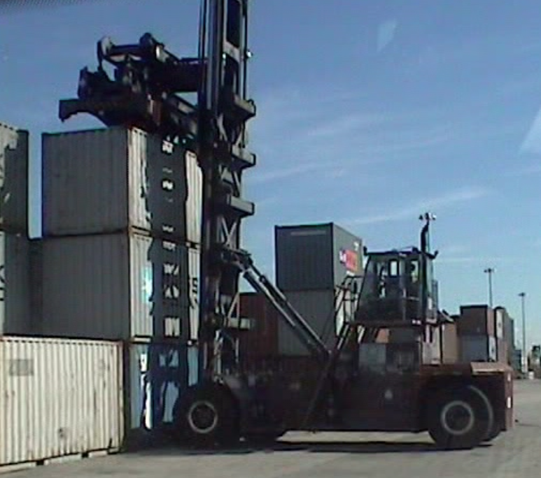 Top Loader Placing a Container on a Stack